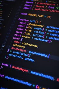 Close-up of vibrant JavaScript code for web development with ReactJS and Tailwind CSS.